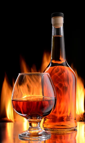 Bottle and glass of cognac — Stock Photo, Image