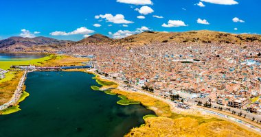 View of Puno with Lake Titicaca in Peru clipart