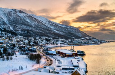 Sunset above the fjord in winter in Tromso, Norway clipart