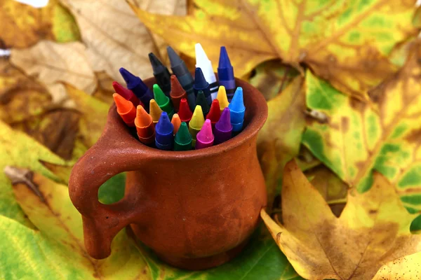 Crayons lying in vase — Stock Photo, Image