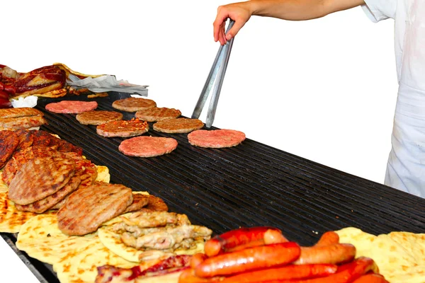 Grilling a burger on the BBQ — Stock Photo, Image