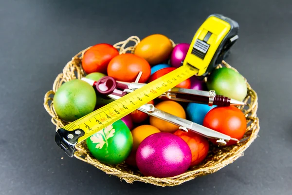 Decorated Easter eggs in a engineer woven basket — Stock Photo, Image