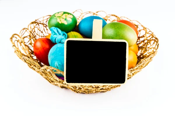 Easter eggs with black board, isoalted on white — Stock Photo, Image