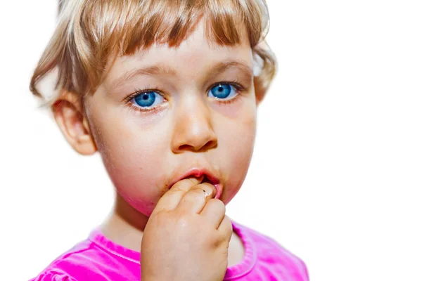 Little girl eating tomato — Stock Photo, Image