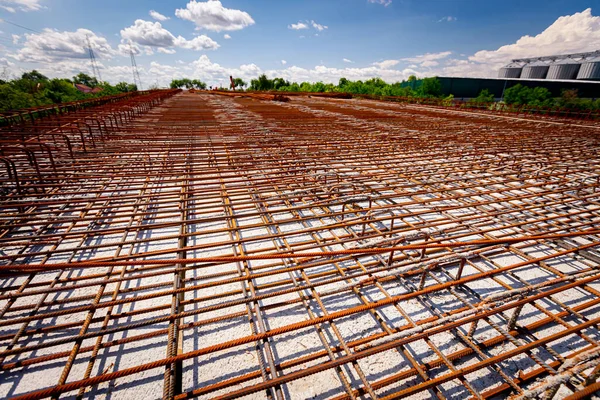 Rusty quadratic reinforcement mesh for concrete was placed for strength the bridge at construction site.