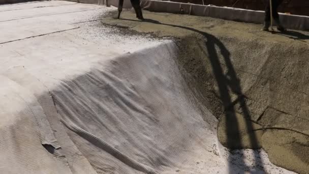 Construction Worker Directing Pump Tube Right Direction Pouring First Layer — Stockvideo