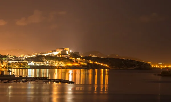 Ibiza island night view of Eivissa town and sea lights reflectio — Stock Photo, Image