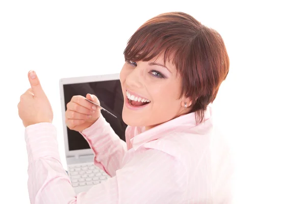 Happy beautiful woman holding credit card and laptop — Stock Photo, Image