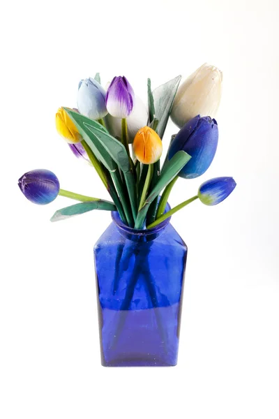 Blue vase with wooden flowers — Stockfoto