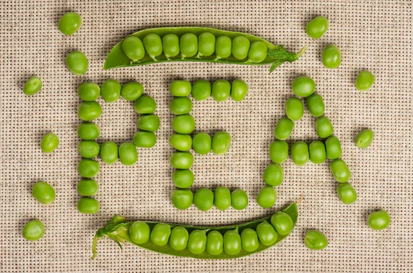 Inscription of peas — Stock Photo, Image