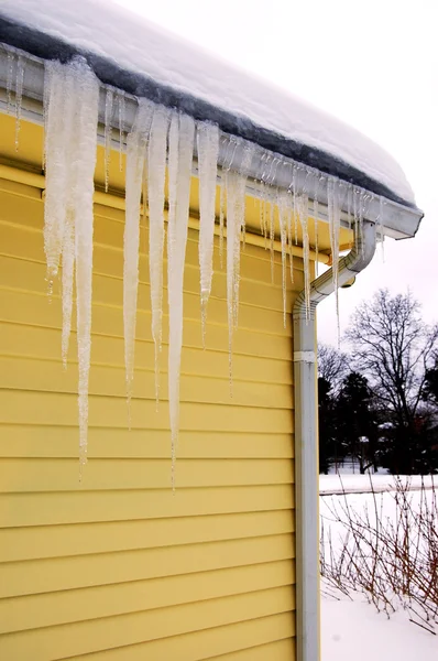 Icicles on gutter — Stock Photo, Image