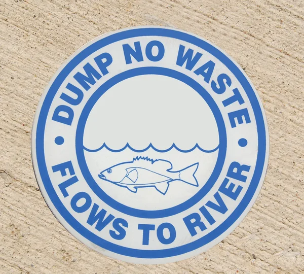 Drain sign "Dump no waste Flows to River" — Stock Photo, Image