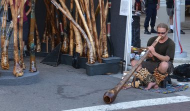 Didgeridoo player at Ann Arbor Art Fair clipart