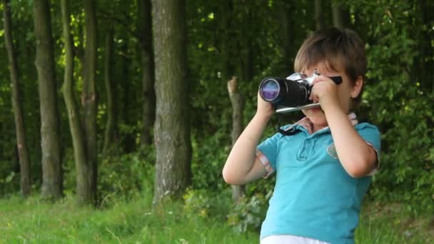 Boy with camera — Stock Video