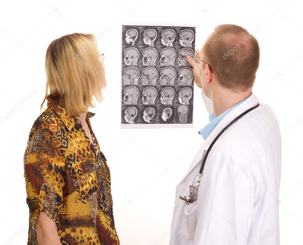 Male medical doctor examining a female patient