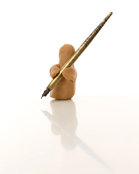 Modeling clay figure with a nib — Stock Photo, Image