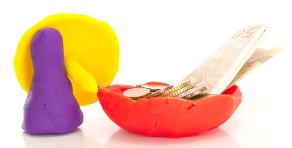 Modelling clay figure with umbrella and money — Stock Photo, Image