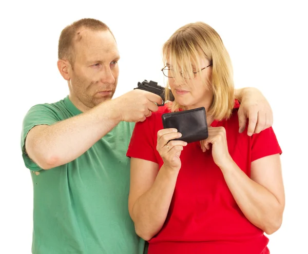 A man hold a woman at gunpoint — Stock Photo, Image