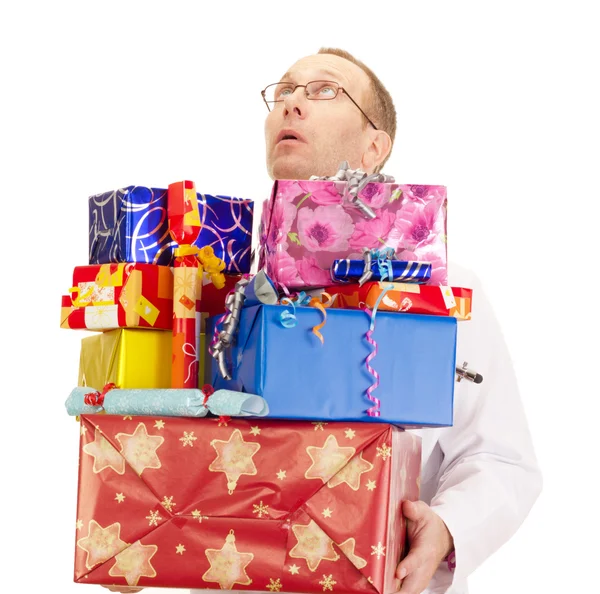 Doctor con un montón de regalos — Foto de Stock