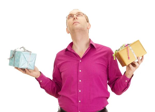 Uma pessoa de negócios fazendo malabarismo com dois presentes coloridos — Fotografia de Stock