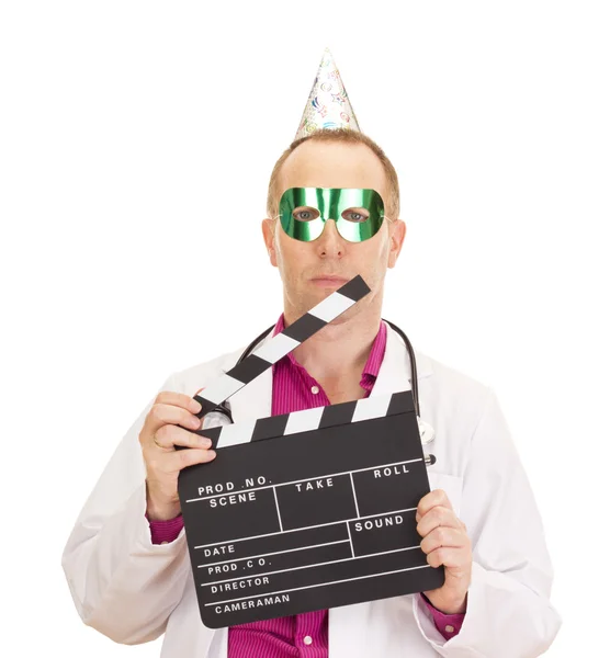 A male medical doctor with a clapperboard — Stock Photo, Image