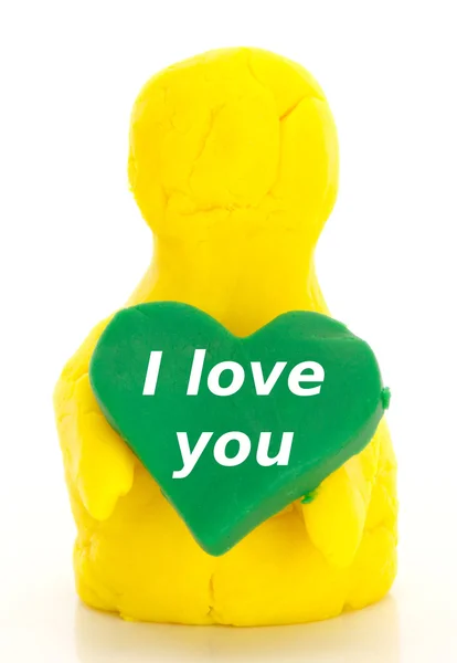 Modelling clay figure with a heart — Stock Photo, Image