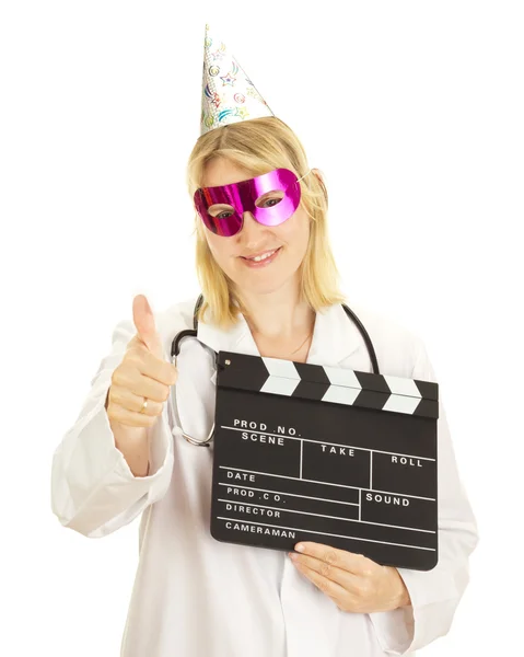 A female medical doctor with a clapperboard — Stock Photo, Image