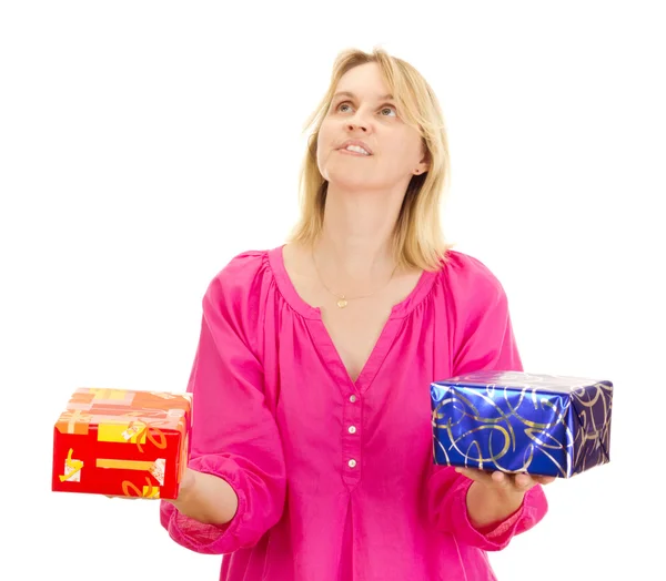 A female person juggling with two colorful gifts — Stock Photo, Image