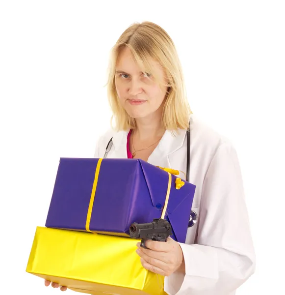 Medical doctor with gifts and a gun — Stock Photo, Image