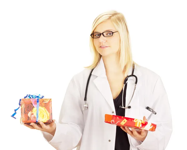 Medical doctor with two gifts — Stock Photo, Image