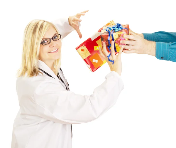 Medical doctor grabbing two gifts — Stock Photo, Image