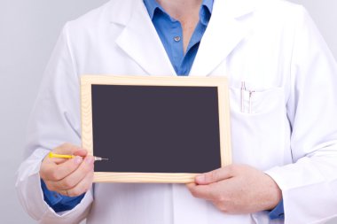 Doctor shows information on blackboard clipart