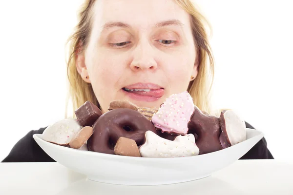 Person eating some delicate gingerbreads — Stock Photo, Image