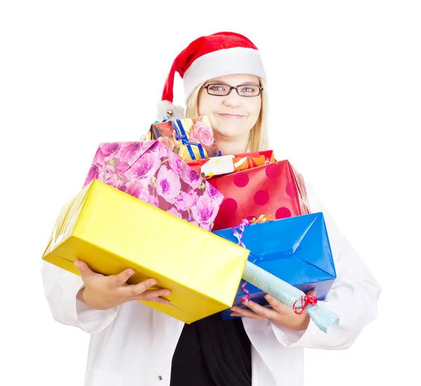 Medical doctor with a lot of christmas gifts — Stock Photo, Image