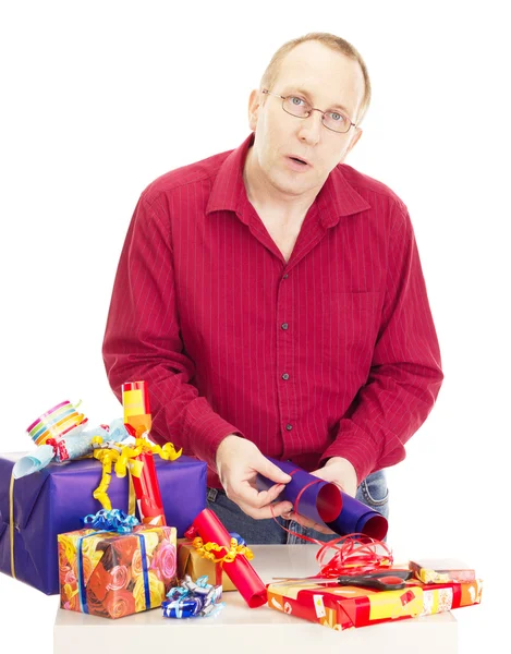 Person packaging some colorful gifts — Stock Photo, Image