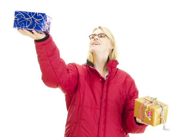 A female person juggling with two colorful gifts — Stock Photo, Image