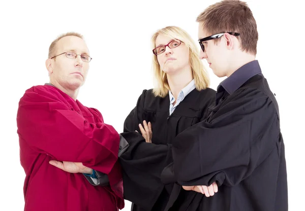 Три юриста обсуждают иск — стоковое фото