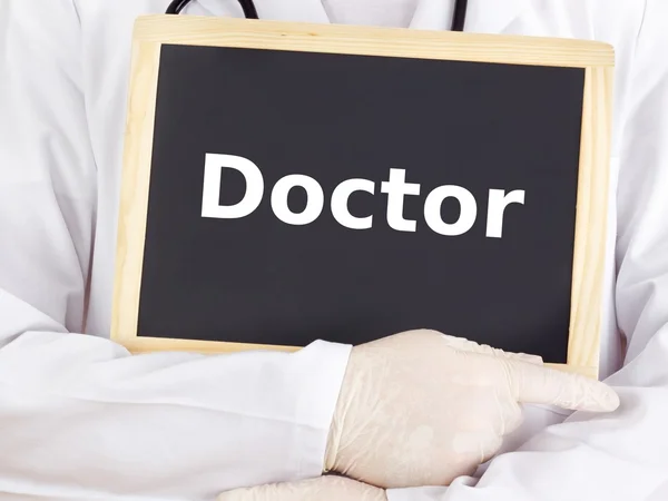 Doctor shows information on blackboard: doctor — Stock Photo, Image