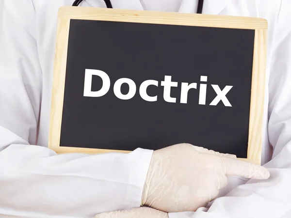 Doctor shows information on blackboard: doctrix — Stock Photo, Image