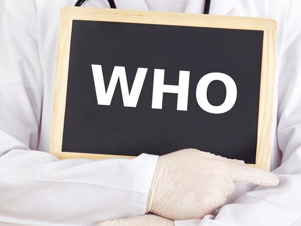 Doctor shows information on blackboard: who