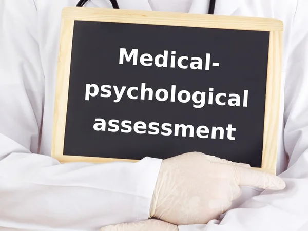 Doctor shows information on blackboard: medical-psychological assessment — Stock Photo, Image