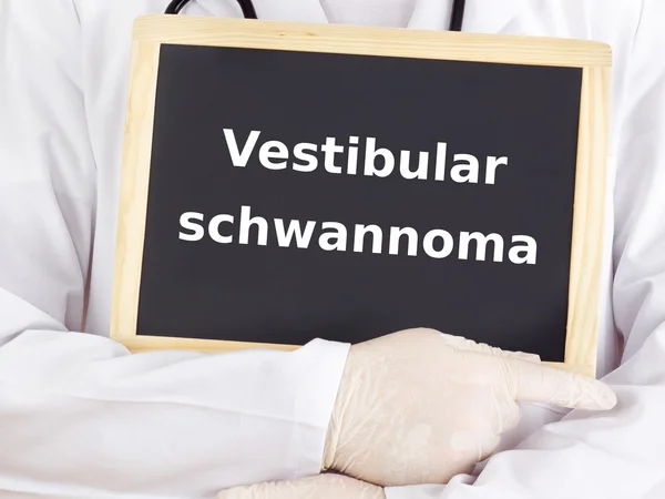 Doctor shows information on blackboard: vestibular schwannoma — Stock Photo, Image