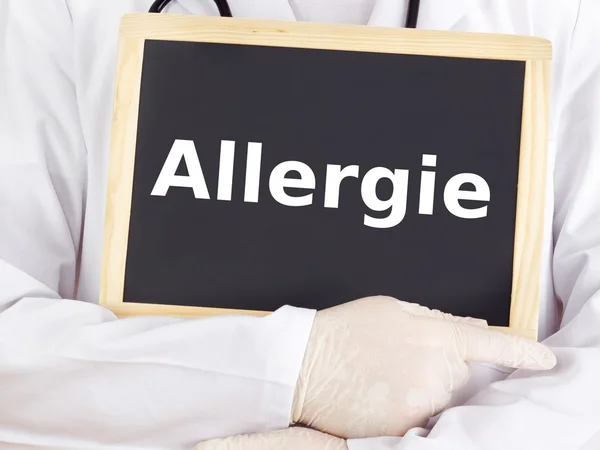 Doctor shows information on blackboard: allergy — Stock Photo, Image