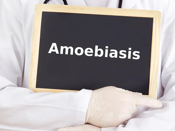 Doctor shows information on blackboard: amoebiasis — Stock Photo, Image