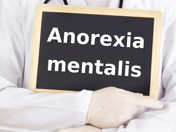 Doctor shows information: anorexia nervosa — Stock Photo, Image