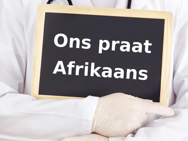 Lekarz pokazuje informacje: mówimy afrikaans — Zdjęcie stockowe
