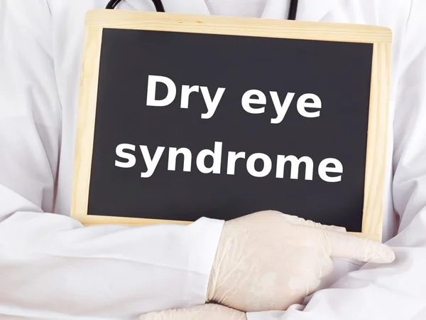 Doctor shows information: dry eye syndrome — Stock Photo, Image