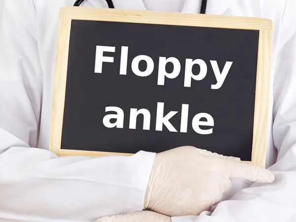 Doctor shows information: floppy ankle — Stock Photo, Image