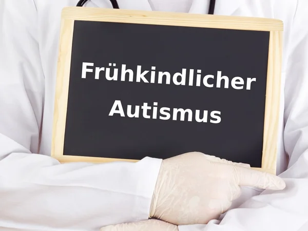 Doctor shows information: early infantile autism — Stock Photo, Image