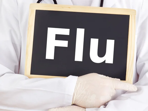 Doctor shows information on blackboard: flu — Stock Photo, Image
